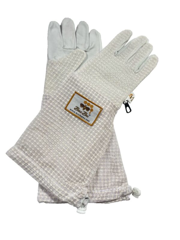 Three-layer ventilated beekeeping gloves with cowhide leather, long sleeves, and ergonomic stitching for ultimate protection and comfort.