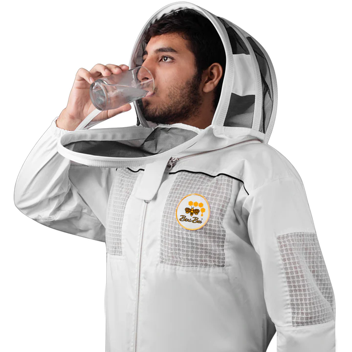 A man wearing a beekeeper suit with a zippered net on the face, highlighting its design feature for convenient hydration access, perfect for sale to beekeeping enthusiasts.